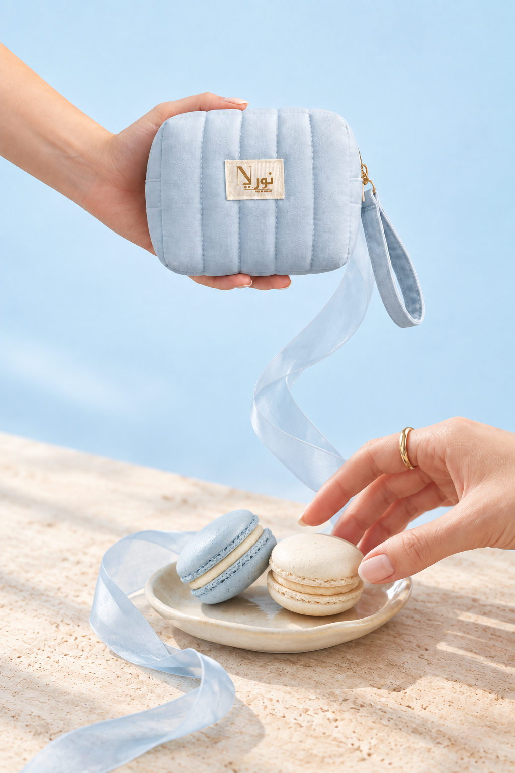 Baby-blue Nuri pouch with connected macaron scene