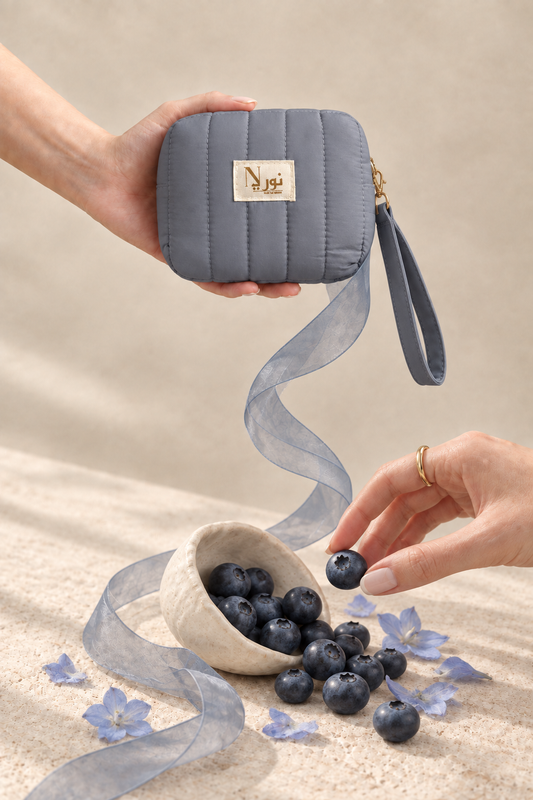 Slate-blue Nuri pouch with blueberry still life